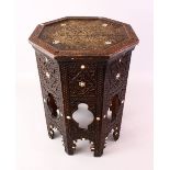 A 19TH CENTURY DAMASCUS ENGRAVED OCTAGONAL WOODEN TABLE, with mother of pearl inlays and carved