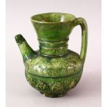 A GOOD ISLAMIC AUMAYAD GREEN GLAZED POTTERY EWER, 15.5cm high.