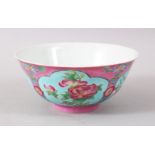 A CHINESE PINK GROUND FAMILLE ROSE PORCELAIN BOWL, the body decorated upon a pink ground with panels