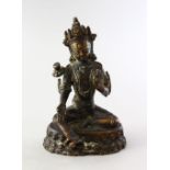 A POSSIBLE TIBETAN BRONZE FIGURE OF BUDDHA, in a seated elegant pose, 11.5cm high.