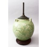 A 19TH CENTURY OR EARLIER CHINESE CARVED CELADON TRIPLE HANDLE PORCELAIN VASE / LAMP, the body of