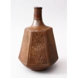A GOOD JAPANESE MEIJI PERIOD HEXAGONAL STONEWARE SAKE FLASK, the body with panels of carved floral