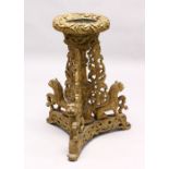 A 18TH / 19TH CENTURY INDIAN CARVED WOODEN JARDINIERE STAND, the stand carved with lions to the