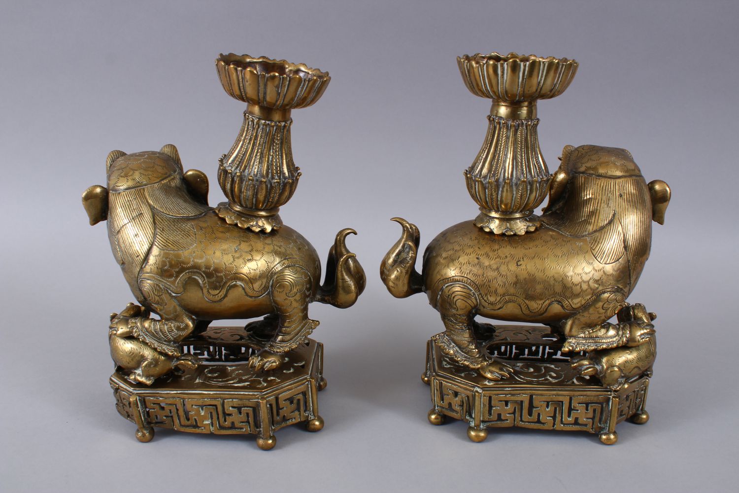 A PAIR OF 19TH / 20TH CENTURY CHINESE BRONZE CANDLESTICKS IN THE FORM OF LION DOGS, the pair of dogs - Image 7 of 11