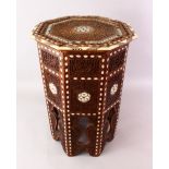 A FINE 19TH CENTURY BONE & MOTHER OF PEARL INLAID OCTAGONAL CARVED WOODEN TABLE, the top and sides