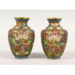 A PAIR OF 20TH CENTURY CHINESE CLOISONNE VASES, the vases with decoration depicting formal rosette