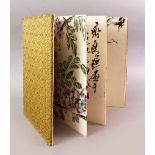 A GOOD 19TH / 20TH CENTURY CHINESE SILK BOUND BOOK OF PAINTINGS BY LI KUSHAN, The book opening to