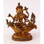A CHINESE GILT BRONZE FIGURE OF A MULTI ARM DEITY, the verso with Chinese engraved signature mark,