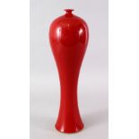 A GOOD CHINESE 19TH / 20TH CENTURY RED GROUND SLENDER PORCELAIN VASE, the body of the slender vase