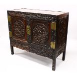 A LOVELY 19TH CENTURY CHINESE HARDWOOD / HONGMU CARVED DRAGON TWO-DOOR CABINET, the door panels