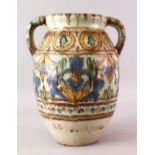 A LARGE NORTH AFRICAN TWIN HANDLE SIGNED POTTERY JAR, with a varying colour drip style decoration