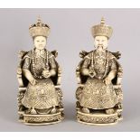 A GOOD PAIR OF 19TH CENTURY CHINESE CARVED IVORY SEATED EMPEROR AND EMPRESS, the figures both