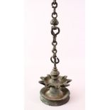 A 17TH / 18TH CENTURY INDIAN INSCRIBED BRONZE HANGING OIL LAMP, 14.5cm diameter.