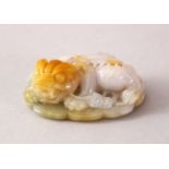 A CHINESE CARVED WHITE JADE FIGURE OF A RECUMBENT BEAST, 6CM.