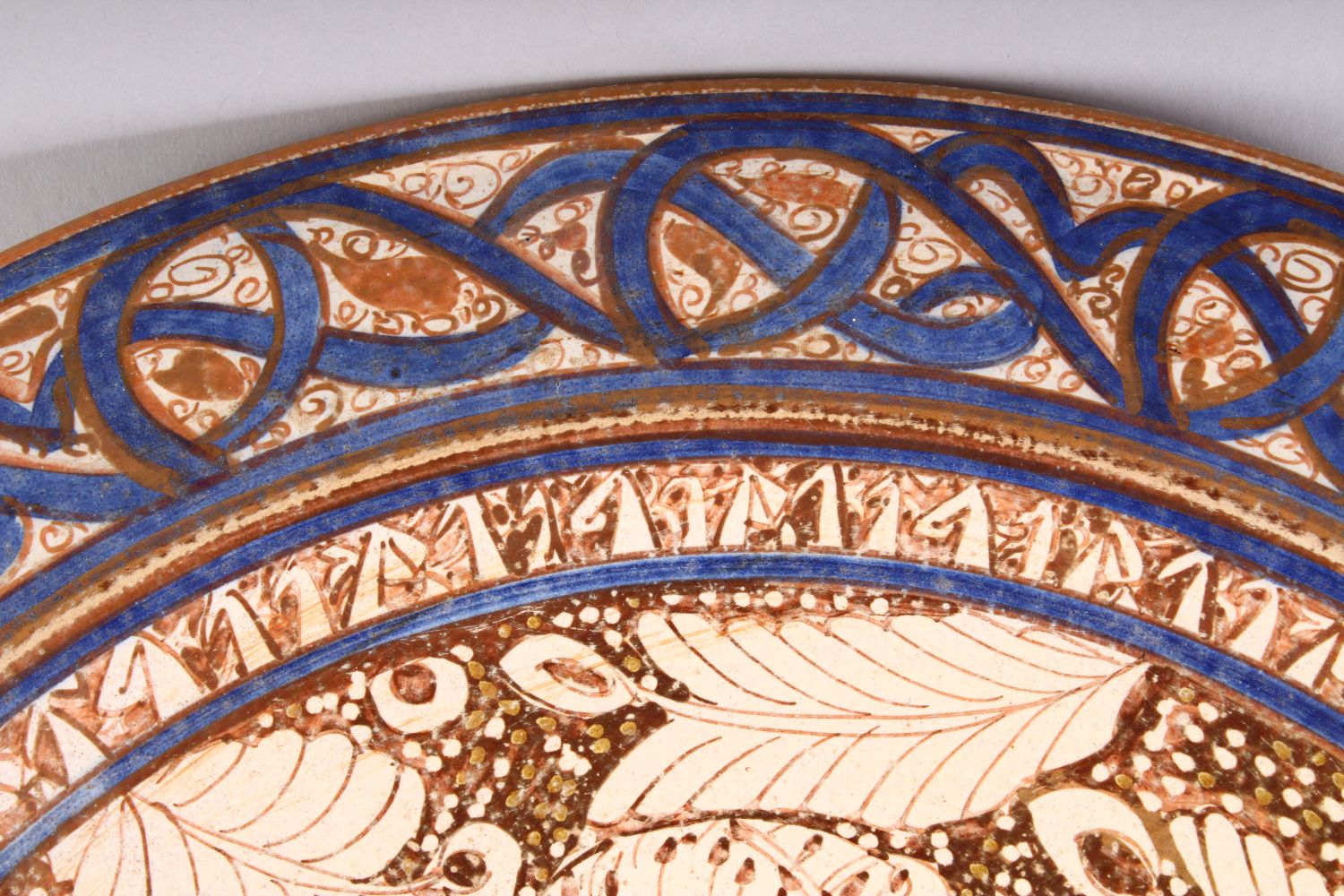A GOOD 19TH CENTURY ISLAMIC PERSIAN POTTERY PLATE, the central decorated with an immortal / - Image 3 of 7