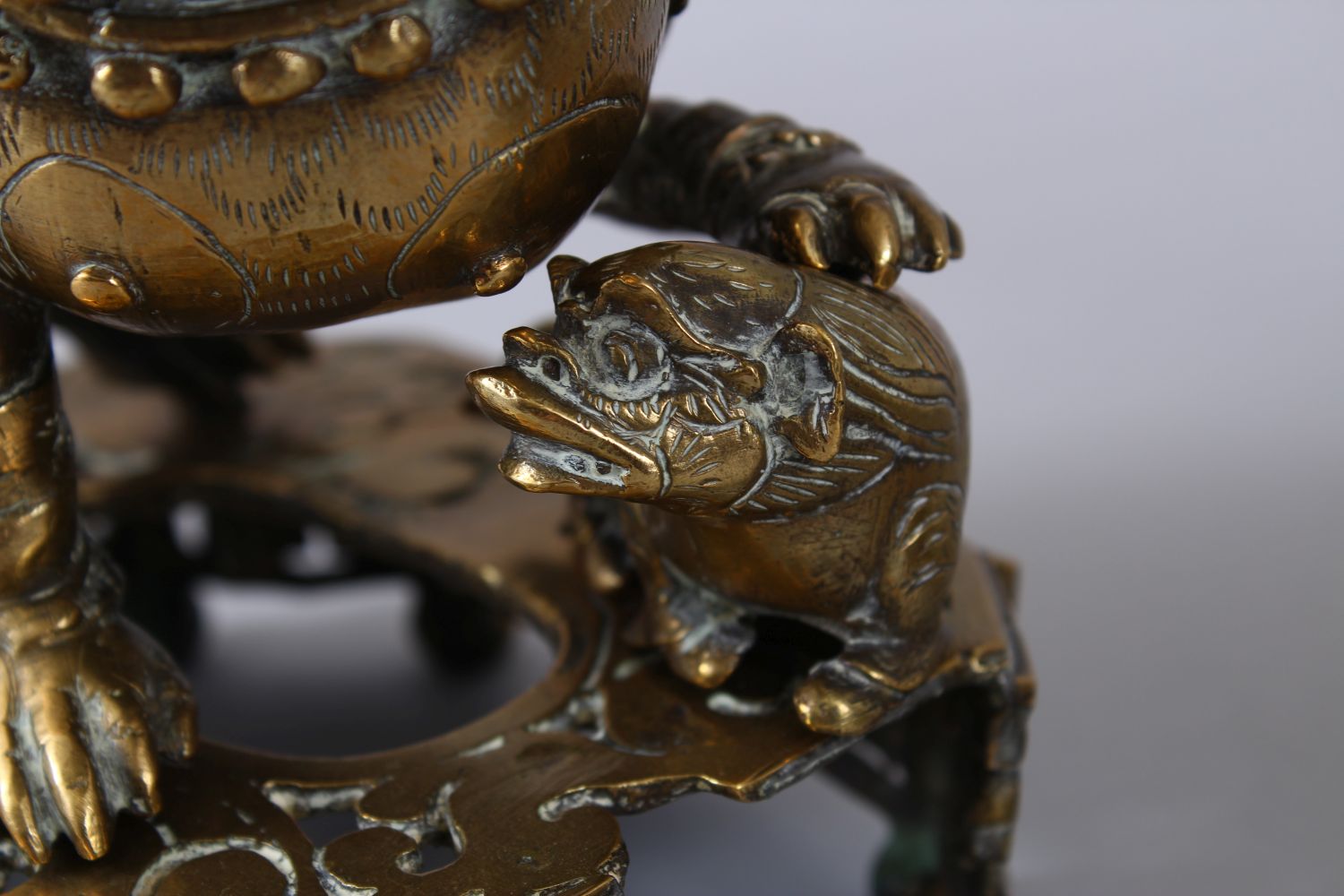 A PAIR OF 19TH / 20TH CENTURY CHINESE BRONZE CANDLESTICKS IN THE FORM OF LION DOGS, the pair of dogs - Image 5 of 11