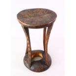 A GOOD 19TH CENTURY CARVED AFRICAN HARDWOOD STOOL, 40cm high.