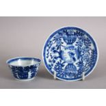 A VERY UNUSUAL CHINESE 18TH CENTURY KANGXI PERIOD BLUE & WHITE PORCELAIN TEA BOWL AND SAUCER, both