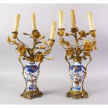 A GOOD PAIR OF 18TH / 19TH CENTURY CHINESE IMARI PORCELAIN VASE / LAMPS, the vases decorated in