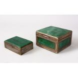 TWO INDIAN WHITE METAL MOUNTED JADEITE BOXES, With chased side border design, 6cm high x 10cm x