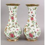 A GOOD PAIR OF 18TH / 19TH CENTURY CHINESE CANTON FAMILLE ROSE PORCELAIN VASES, the vases