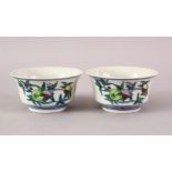 A GOOD PAIR OF CHINESE YONGZHENG STYLE DOUCAI PORCELAIN TEA CUPS, each decorated with pomegranate