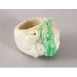 A 20TH CENTURY CHINESE CARVED JADEITE RING, the ring carved with fish amongst lotus, 4cm, internal