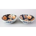 TWO JAPANESE MEIJI PERIOD FLUTED IMARI PORCELAIN BOWLS, both of fluted form, decorated with panels