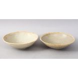 A GOOD PAIR OF EARLY CHINESE POTTERY BOWLS, 14.5cm diameter.