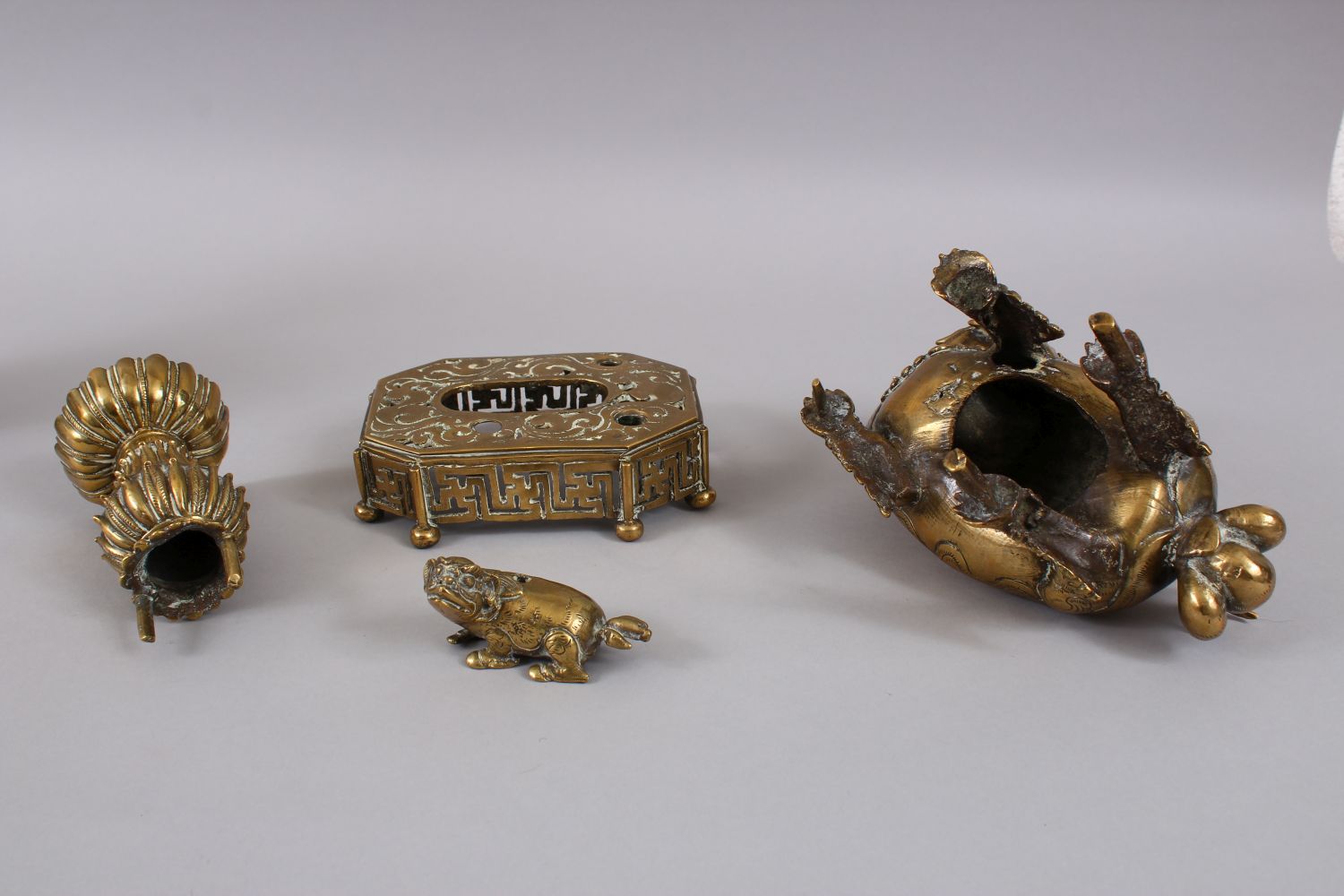 A PAIR OF 19TH / 20TH CENTURY CHINESE BRONZE CANDLESTICKS IN THE FORM OF LION DOGS, the pair of dogs - Image 10 of 11