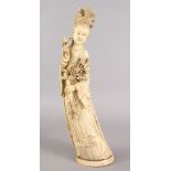 A GOOD 19TH CENTURY CHINESE CARVED IVORY FIGURE OF GUANYIN, stood holding her floral arrangements,