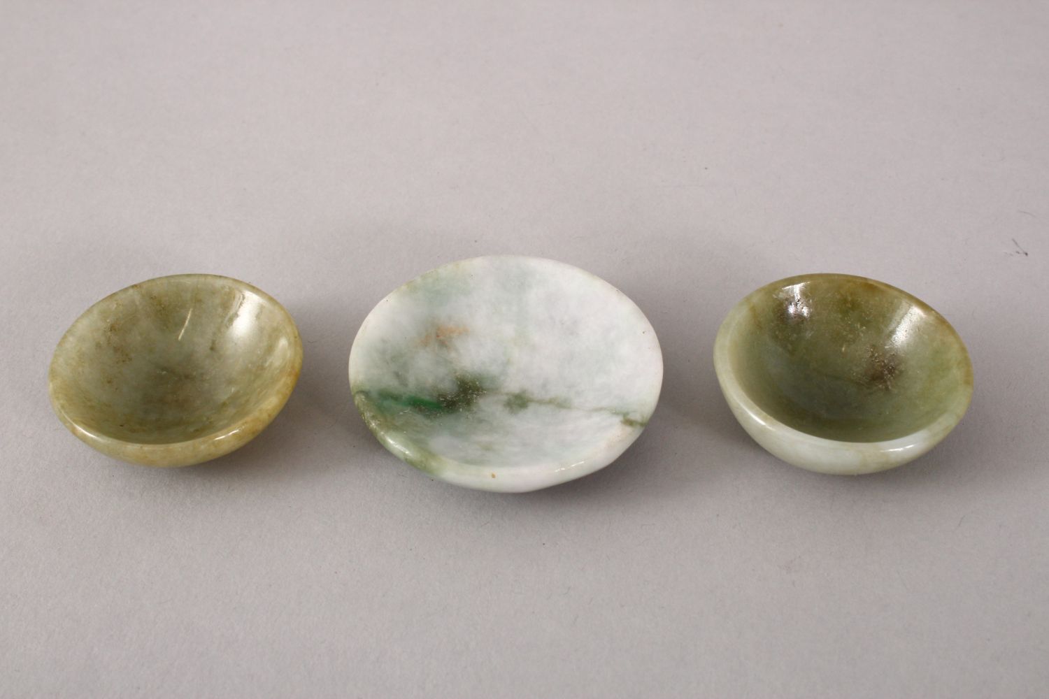 THREE 19TH / 20TH CENTURY CHINESE CARVED JADE / JADEITE BOWLS, 5cm & 4cm. - Image 2 of 3