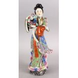 A GOOD CHINESE REPUBLIC PERIOD FAMILLE ROSE PORCELAIN FIGURE OF LAN CAIHE, brightly decorated and