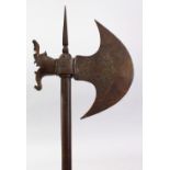 A GOOD 19TH CENTURY PERSIAN QAJAR ENGRAVED STEEL AXE, 84cm long,