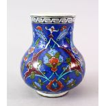 A GOOD IZNIK POTTERY VASE, the body of the vase decorates with native floral design, 12.5cm high.