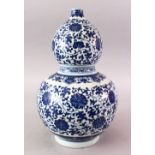 A 20TH CENTURY CHINESE MING STYLE BLUE & WHITE DOUBLE GOURD PORCELAIN VASE, the body decorated