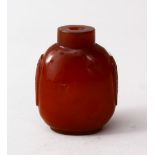 A GOOD 19TH / 20TH CENTURY CHINESE AMBER GLASS SNUFF BOTTLE, the bottle with moulded decoration 6 cm