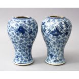 A PAIR OF 17TH CENTURY CHINESE KANGXI BLUE & WHITE PORCELAIN VASES, the body of the vases