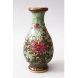 A LATE 19TH CENTURY CHINESE PORCELAIN CELADON VASE WITH FAMILLE ROSE DECORATION, the body with