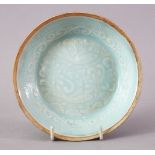 A FINE CHINESE SONG STYLE YINGQING PORCELAIN SAUCER DISH, the central interior decorated with a