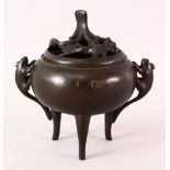 A CHINESE TRIPLE FOOt BRONZE CENSER, the censer with triple long feet, twin moulded mythical