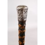 A GOOD 19TH CENTURY CHINESE WHITE METAL TOPPED WALKING CANE, The stick carved in bamboo style,