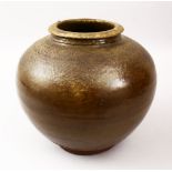 A GOOD CHINESE YUAN PERIOD POTTERY TEA DUST GLAZE JAR, with tea dust ground, an unglazed base