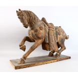A GOOD AND LARGE CHINESE CARVED WOOD MODEL OF A STRIDING HORSE, with carved detailing and