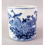 A LATE 19TH CENTURY CHINESE BLUE & WHITE PORCELAIN BRUSH POT, the body decorated with native