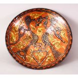 A GOOD IRANIAN NISHABOUR POTTERY BOWL, a red ground decorated with scenes of birds, 22.5cm