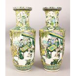 A PAIR OF 19TH CENTURY CHINESE ROULEAU FAMILLE VERTE PORCELAIN VASES, the body of the vases with