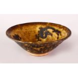 A GOOD 19TH / 20TH CENTURY CHINESE JIZHOU BROWN GLAZED POTTERY DRAGON DISH, the interior decorated