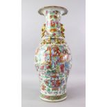 A LARGE 19TH CENTURY CHINESE FAMMILE ROSE CANTON PORCELAIN VASE, with panel decoration of figures