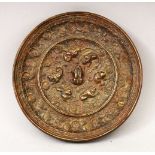 A GOOD 19TH CENTURY OR EARLIER CHINESE BRONZE MIRROR, of circular form, with cast beast and grape